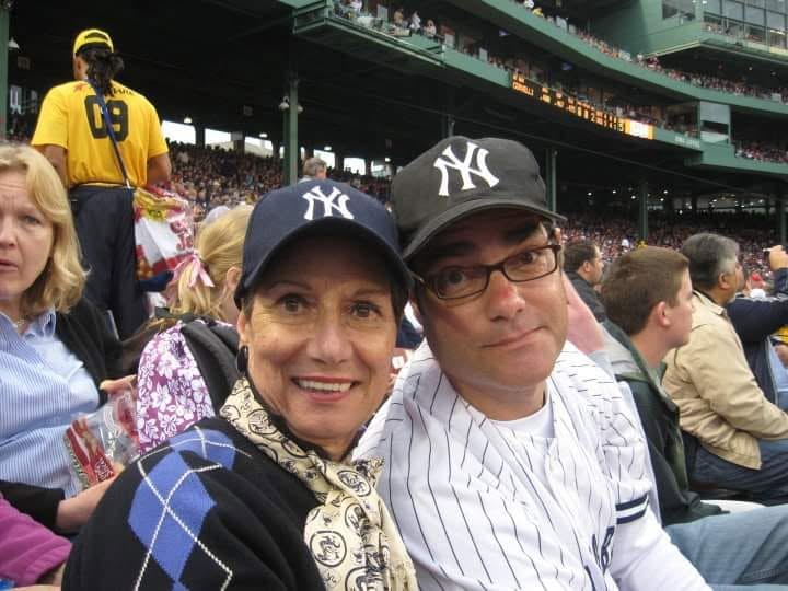 Matthew S Crawford and his mother in Yankees caps in the stands at Fenway Park in Boston