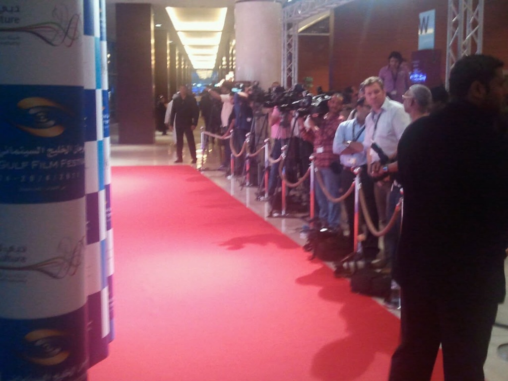 Photographers and TV cameras lining the Gulf Film Festival red carpet