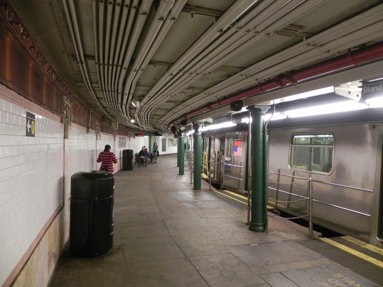 MTA subway train arriving at a New York City station platform
