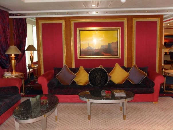 Red living room with gold cushions in the Presidential Suite at the Burj Al Arab, Dubai