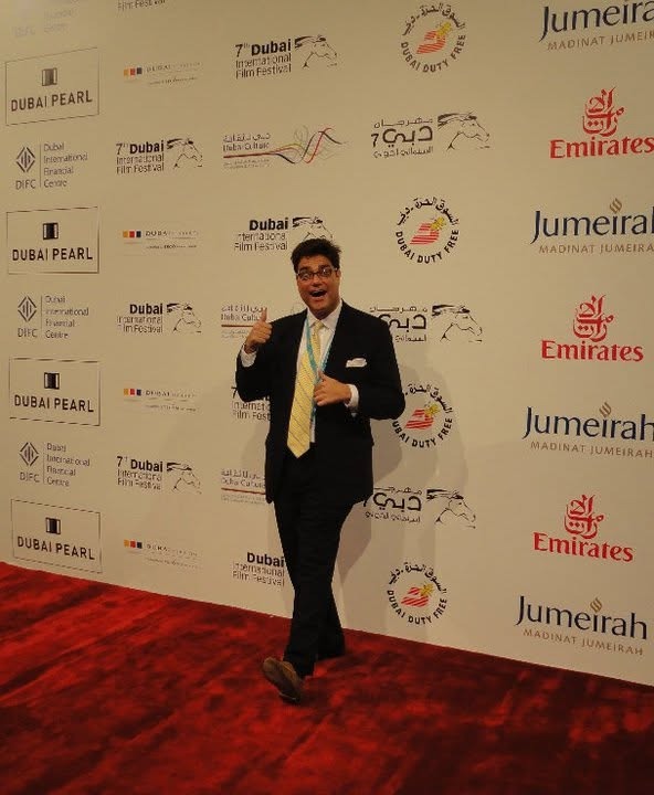 Matthew giving a thumbs-up on the Dubai International Film Festival red carpet