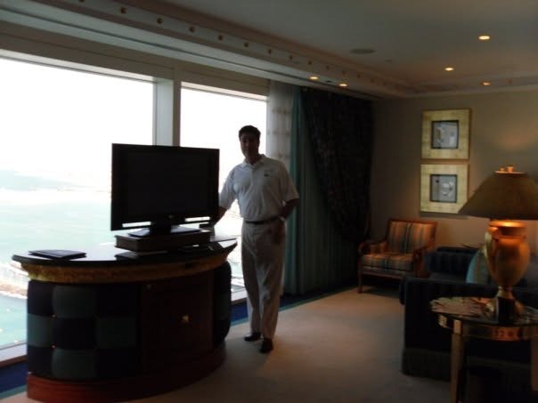 Matthew in the suite's media room with a TV and Gulf view